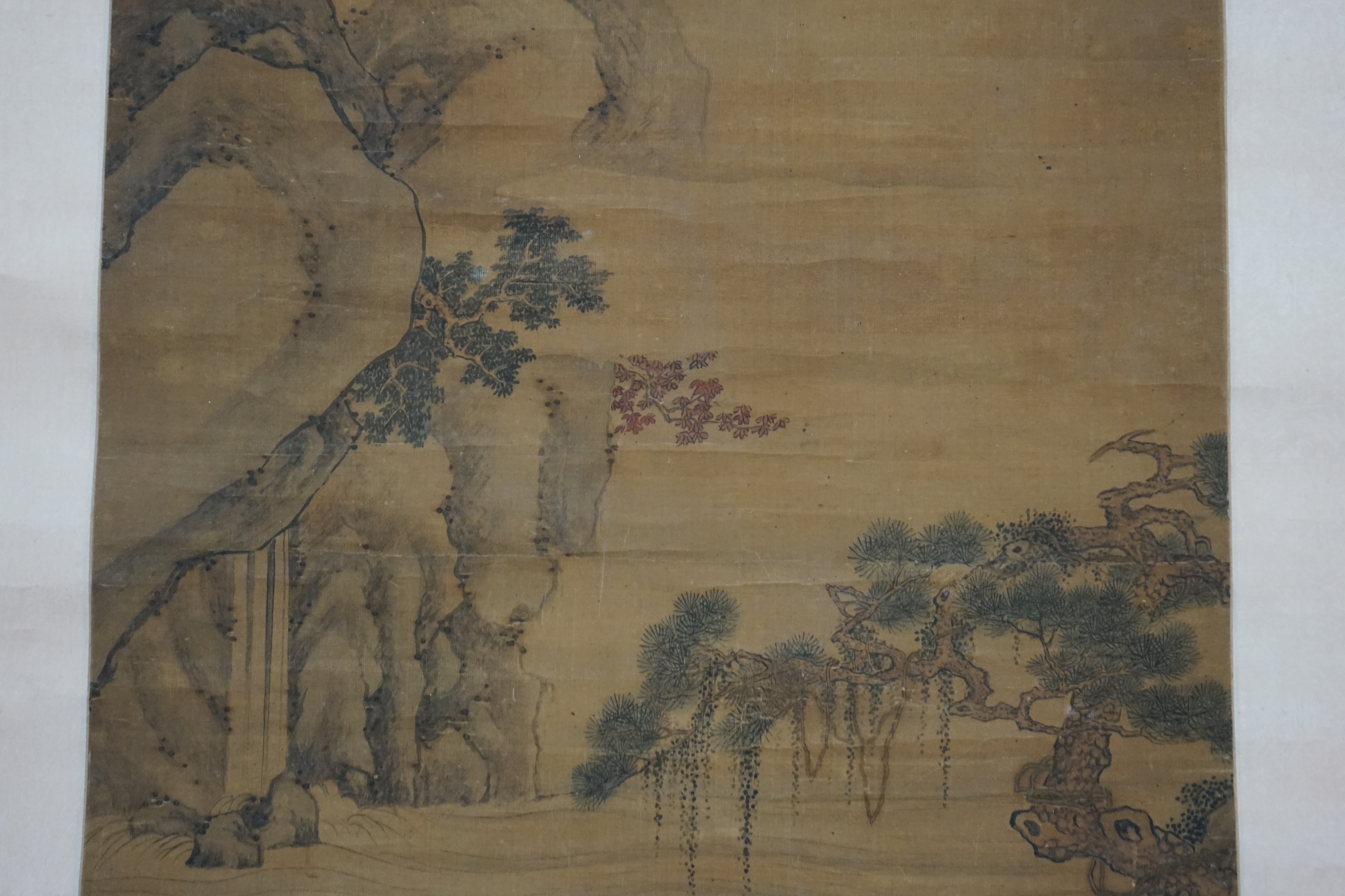 Chinese School, 18th century, a scroll painting on silk of figures on a boat, signed Qiu Ying